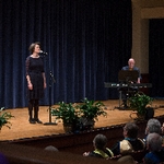Two musicians perform on stage